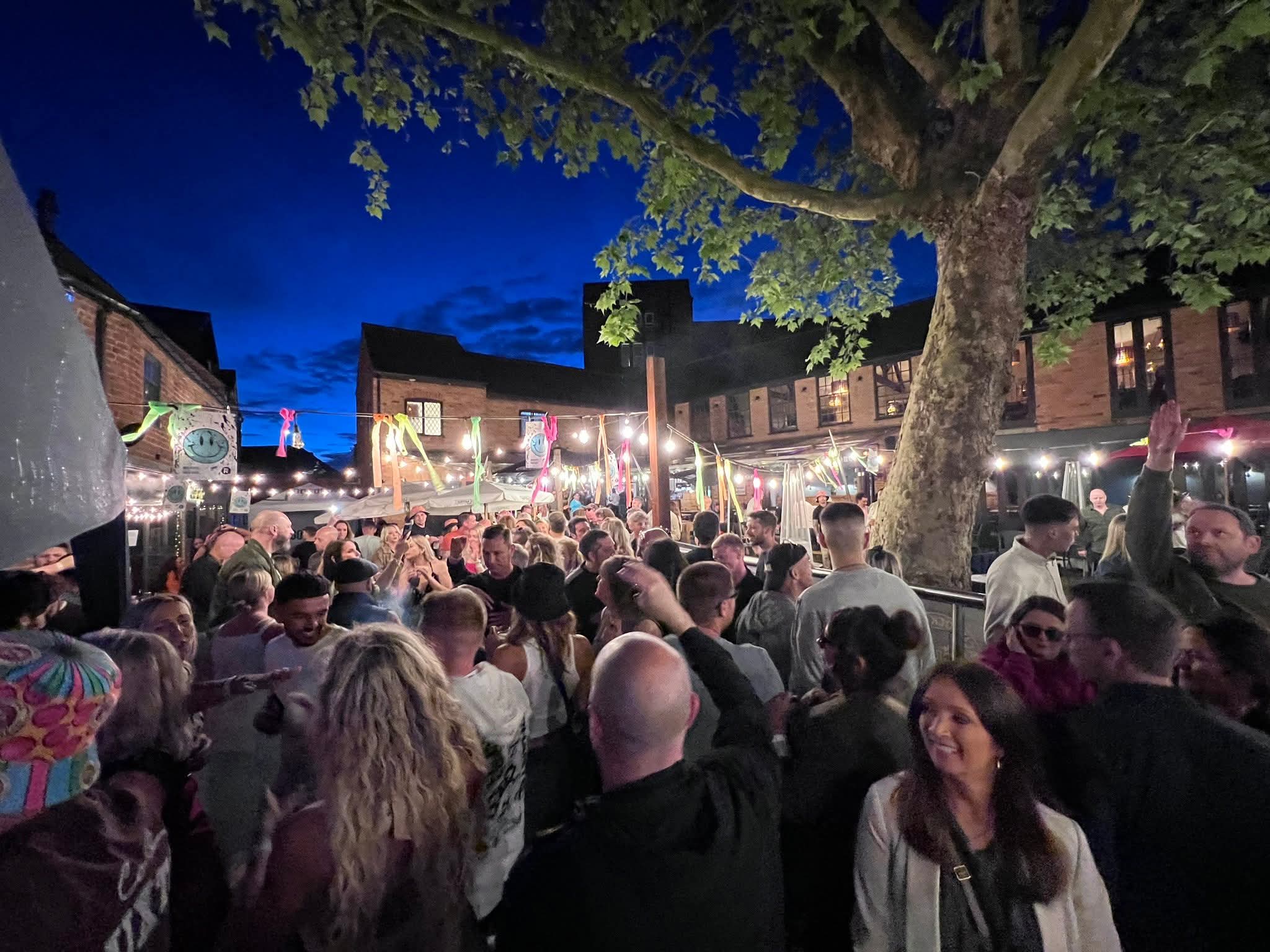 Crowd dancing at an outdoor event
